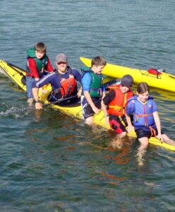 Four kids plus instructor on kayak