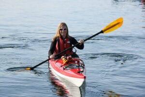 Woman Kayaking While Smiling
