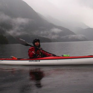 Person kayaking in the rain