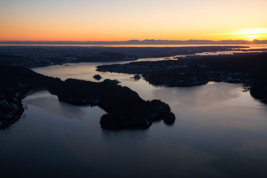 Aerial view of Deep Cove during a vibrant sunset