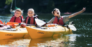 3 Children in kayak having fun