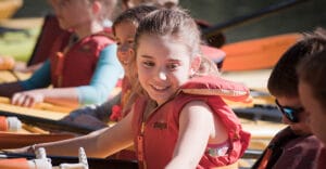 Child in Kayak Smiling